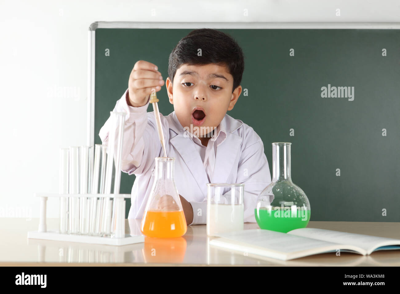 Schoolboy experimenting in a chemistry lab Stock Photo - Alamy
