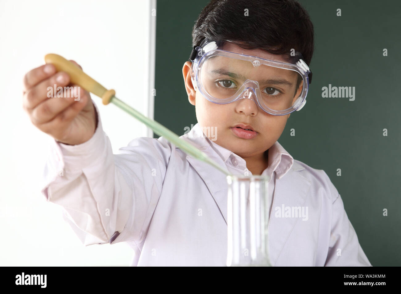 Schoolboy experimenting in a chemistry lab Stock Photo - Alamy