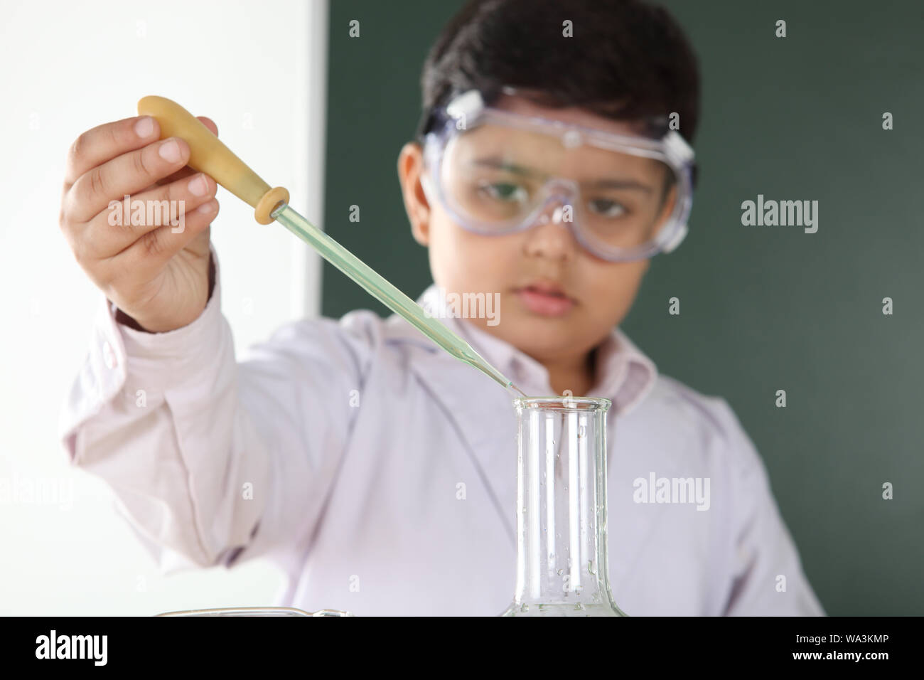 Schoolboy experimenting in a chemistry lab Stock Photo - Alamy