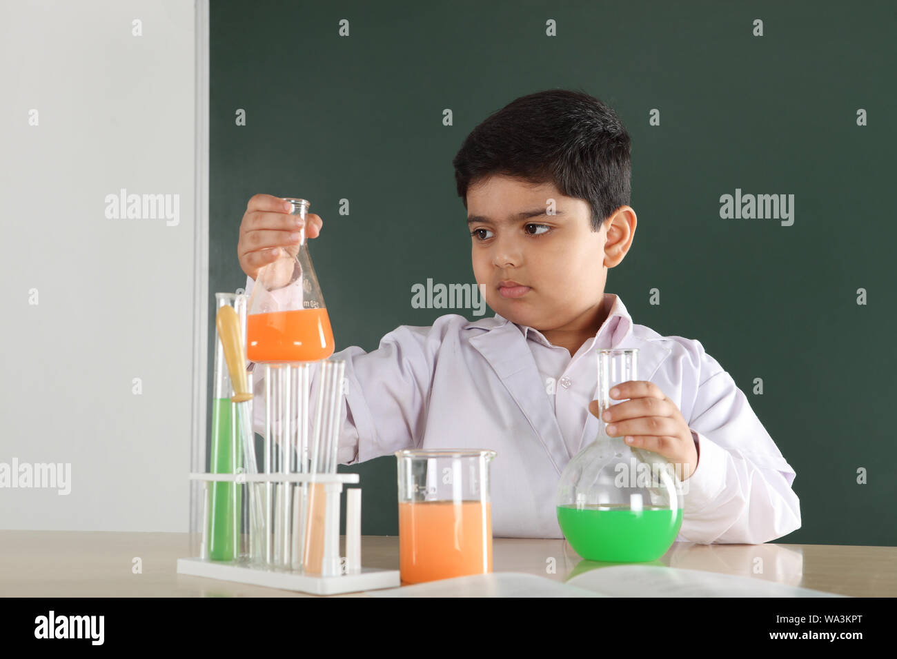 Schoolboy experimenting in a chemistry lab Stock Photo - Alamy