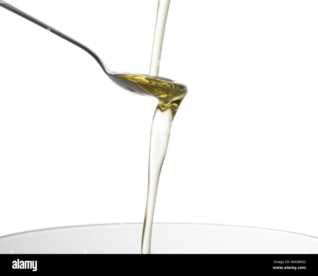 The spoon down in olive oil Stock Photo Alamy