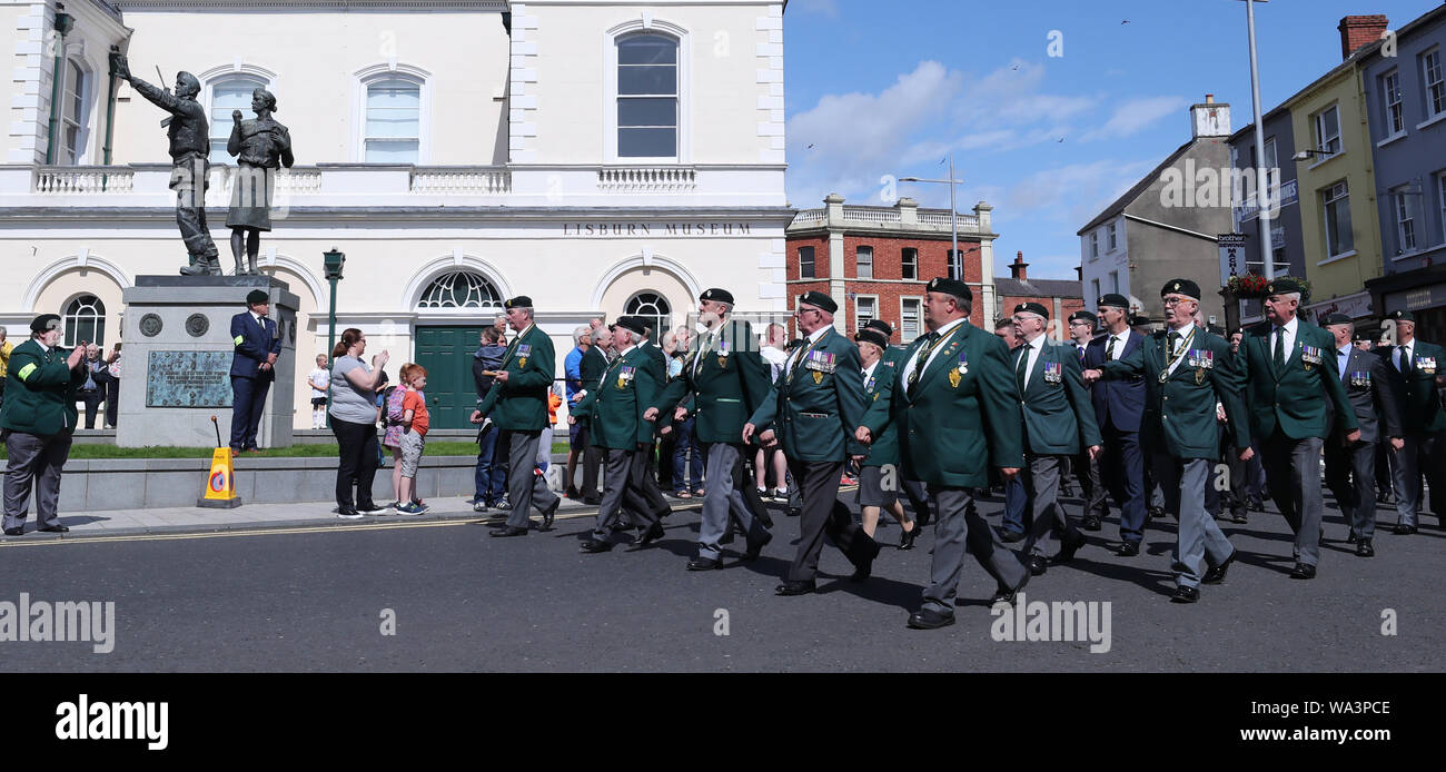 Veterans pass by the udr memorial in lisburn hi-res stock photography