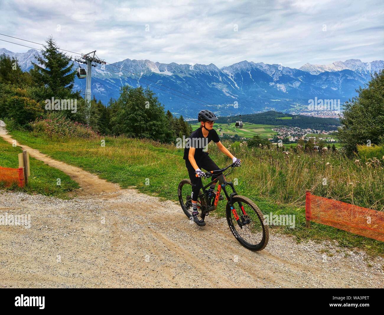 Mutters Innsbruck, Austria. 17th Aug, 2019. A mountain biker rides down one of the courses at Bikepark Innsbruck in Austria. Credit: Sachelle Babbar/ZUMA Wire/Alamy Live News Stock Photo