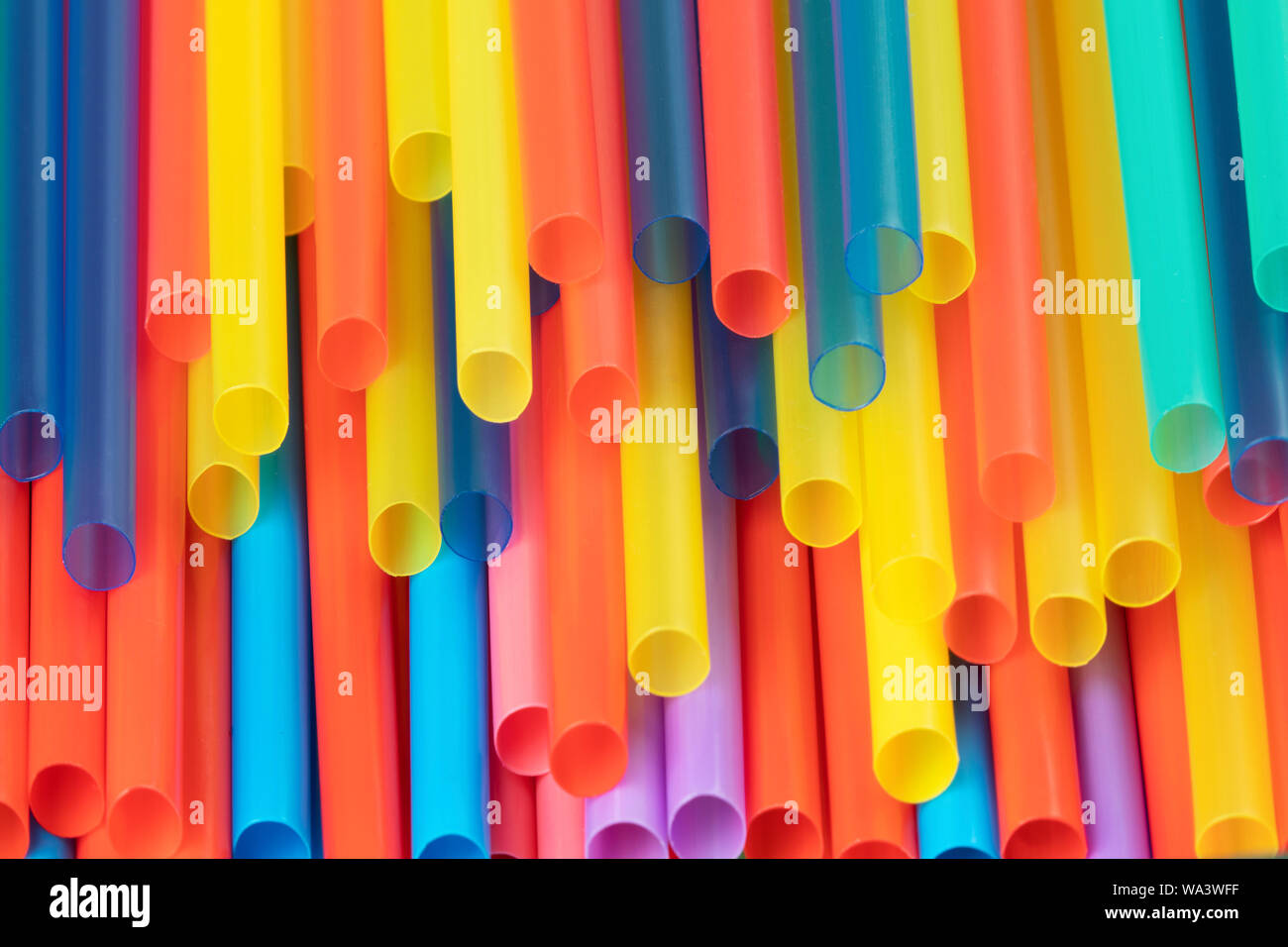 A background of colorful plastic straws used to illustrate plastic