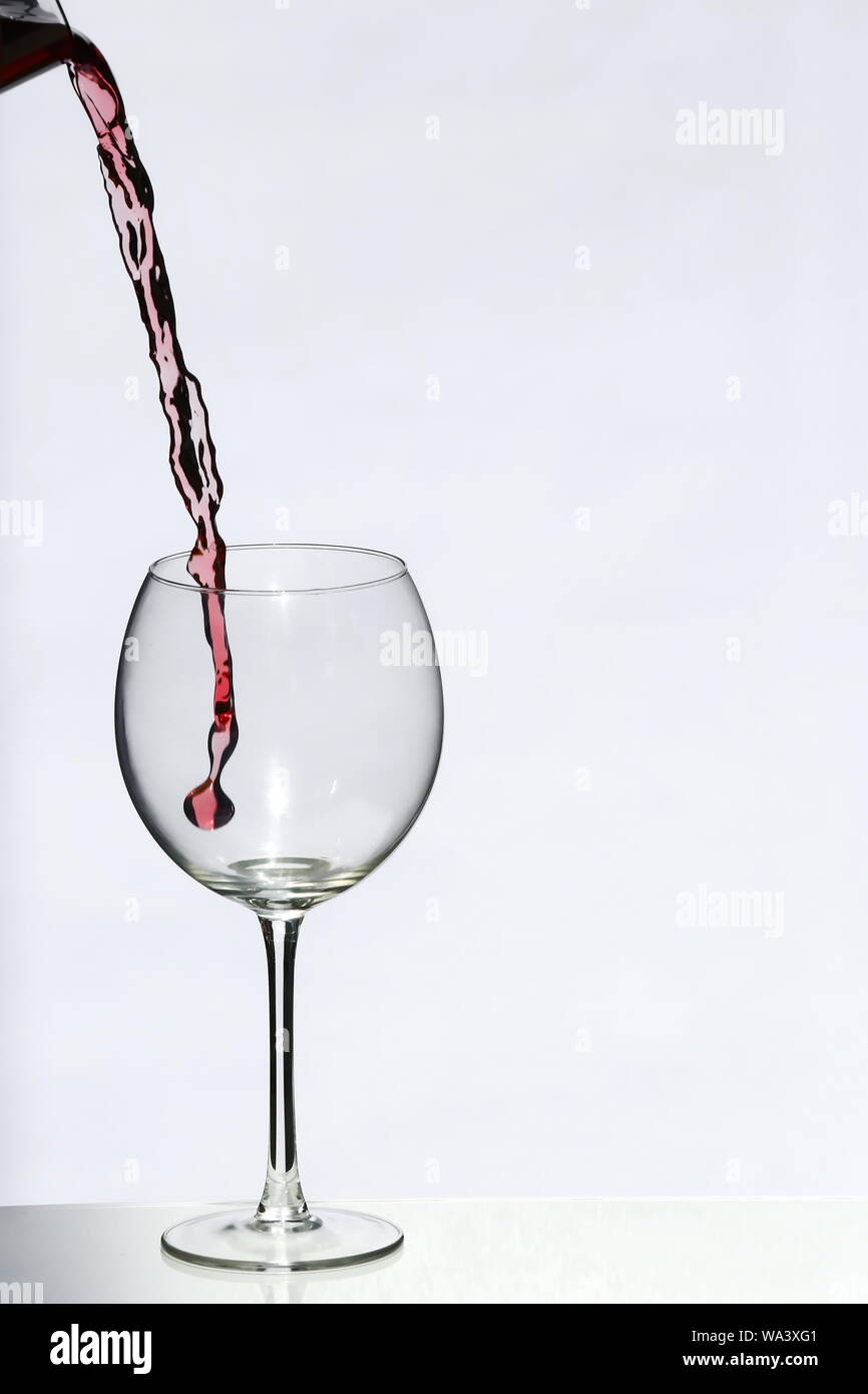 Pour a glass of red wine Stock Photo