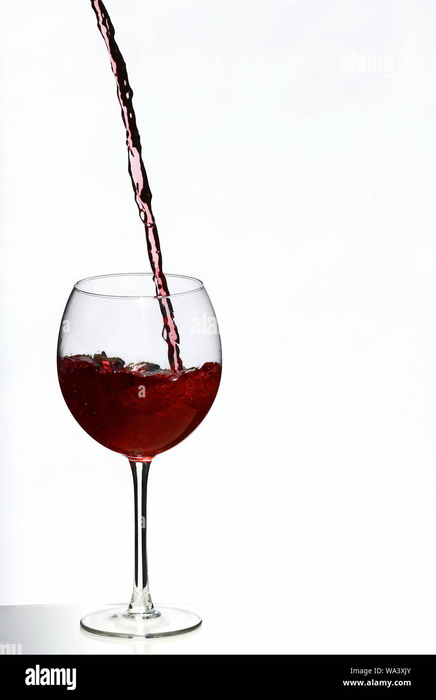 Pour a glass of red wine Stock Photo