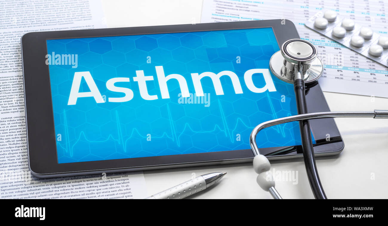 The word Asthma on the display of a tablet Stock Photo