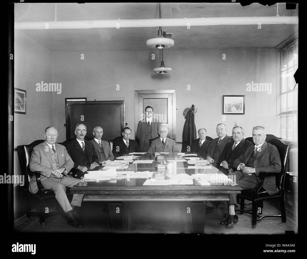 Brains of Aeronautic World represented on National Advisory Committee for Aeronautics. The National Advisory Committee for Aeronautics is photographed in Washington the other day when they met at the Navy Department. The duties of the Committee, as provided by Congress, are to supervise and direct the scientific study of the problems of flight, with a view to their practical solution. In the photograph, left to right: G.W. Lewis; Charles G. Abbet, Secretary of the Smithsonian Institution; Orville Wright, Inventor of the airplane; Commander John H. Towers; U.S.N., here of the first trans-atlant Stock Photo