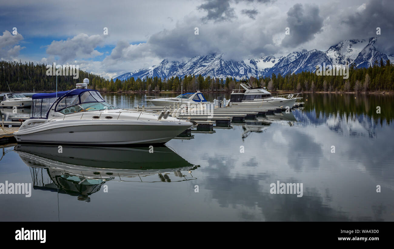 Boats rest in the docks of Jackson Lake, Grand Teton National Park, Wyoming, USA Stock Photo