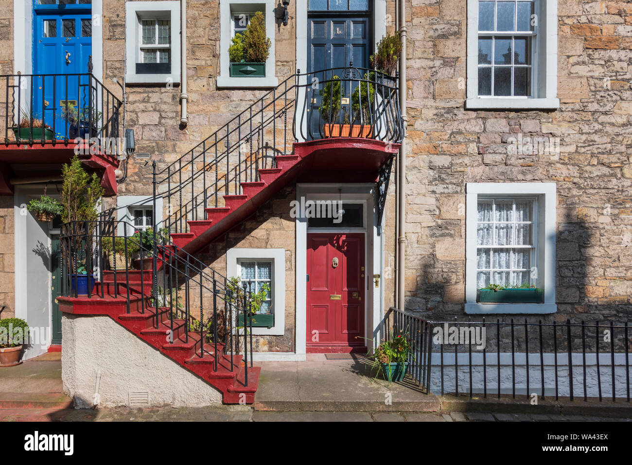 Weaving stairs that  wind up the outside of the front doors to exclusive flats in Ramsay Garden in the Old Town Edinburgh Stock Photo