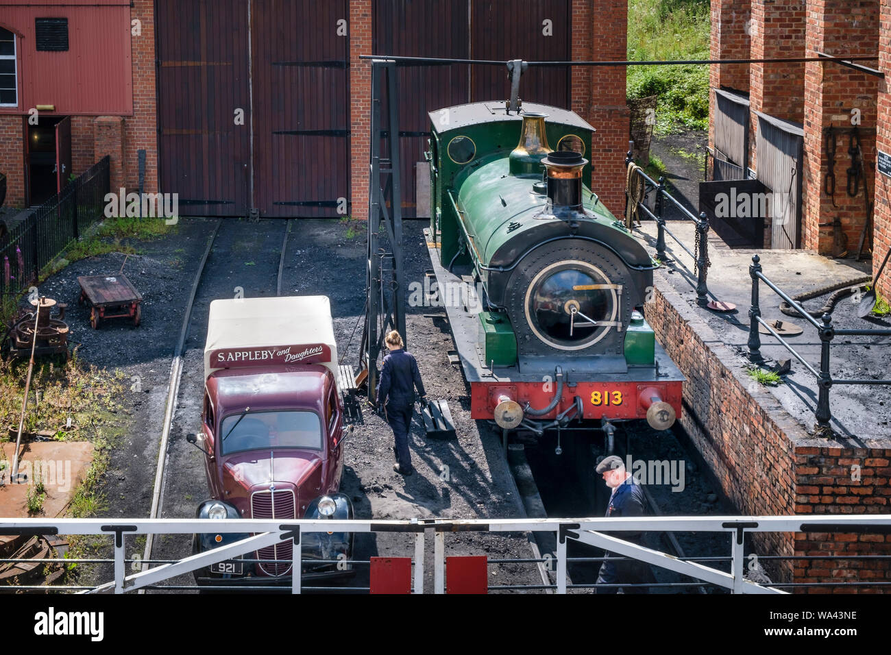 Steam locomotive and old van both exhibits at Beamish Open Air Museum in County Durham Stock Photo
