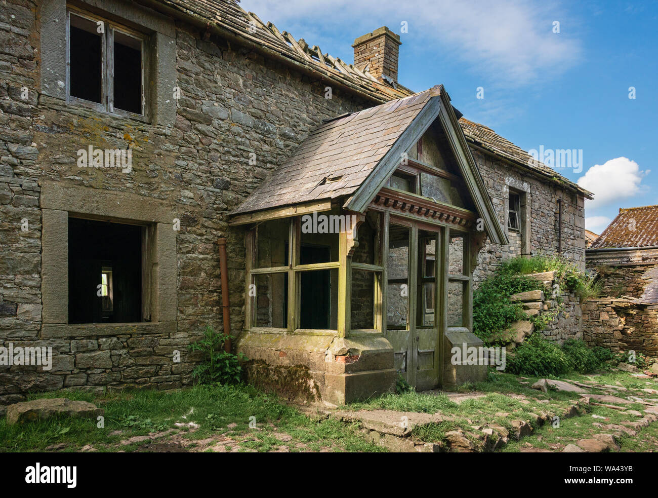 Derelict abandoned ruined farmhouse. This substantial empty deserted house is at Pedam's Oak on Edmondbyres Common in a remote part of County Durham. Stock Photo