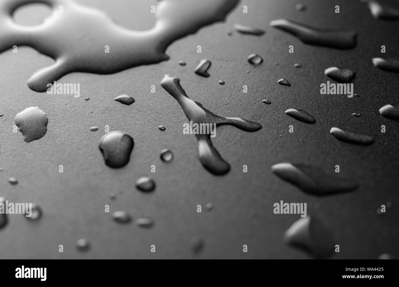 Water drops on the black surface Stock Photo Alamy