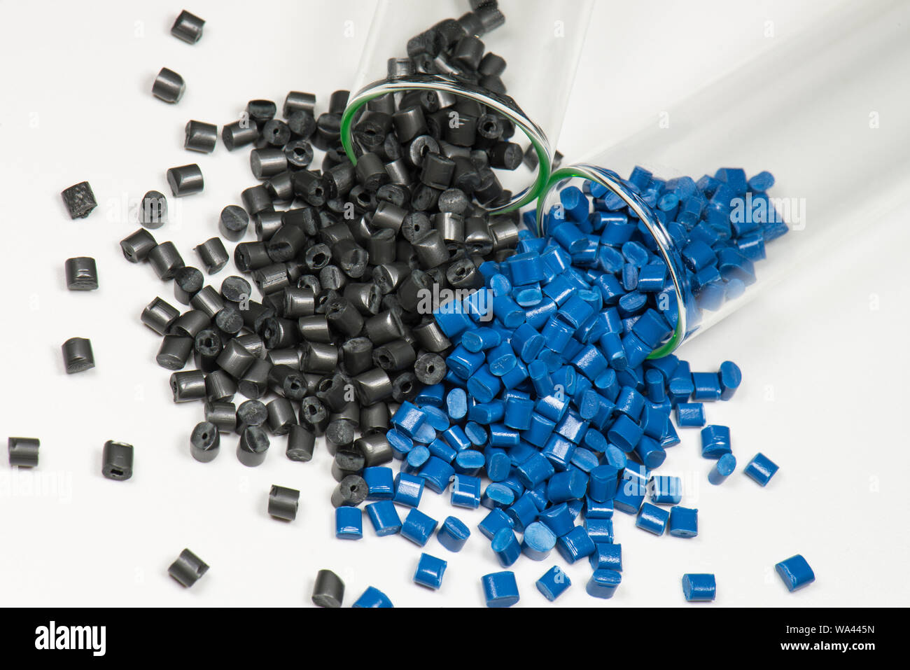 black and blue polymer pellets in test tubes in laboratory Stock Photo