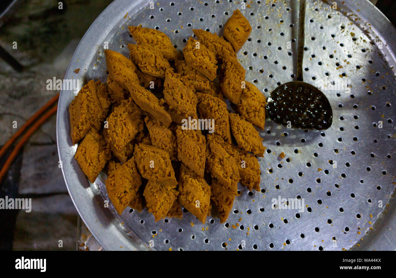 deep fried sweets cooked in an iron pan in Asia Stock Photo Alamy