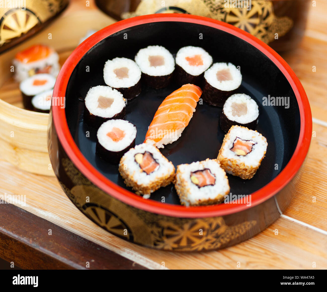 Japanese sushi on a rustic background. Sushi rolls, nigiri and maki. Stock Photo