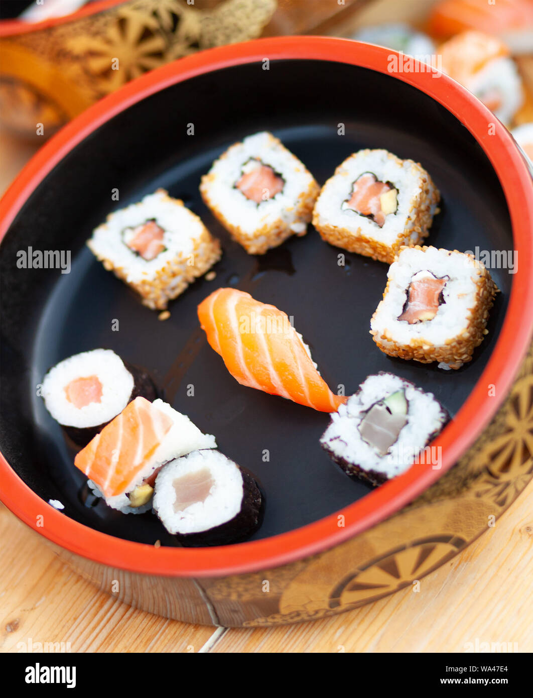 Japanese sushi on a rustic background. Sushi rolls, nigiri and maki. Stock Photo