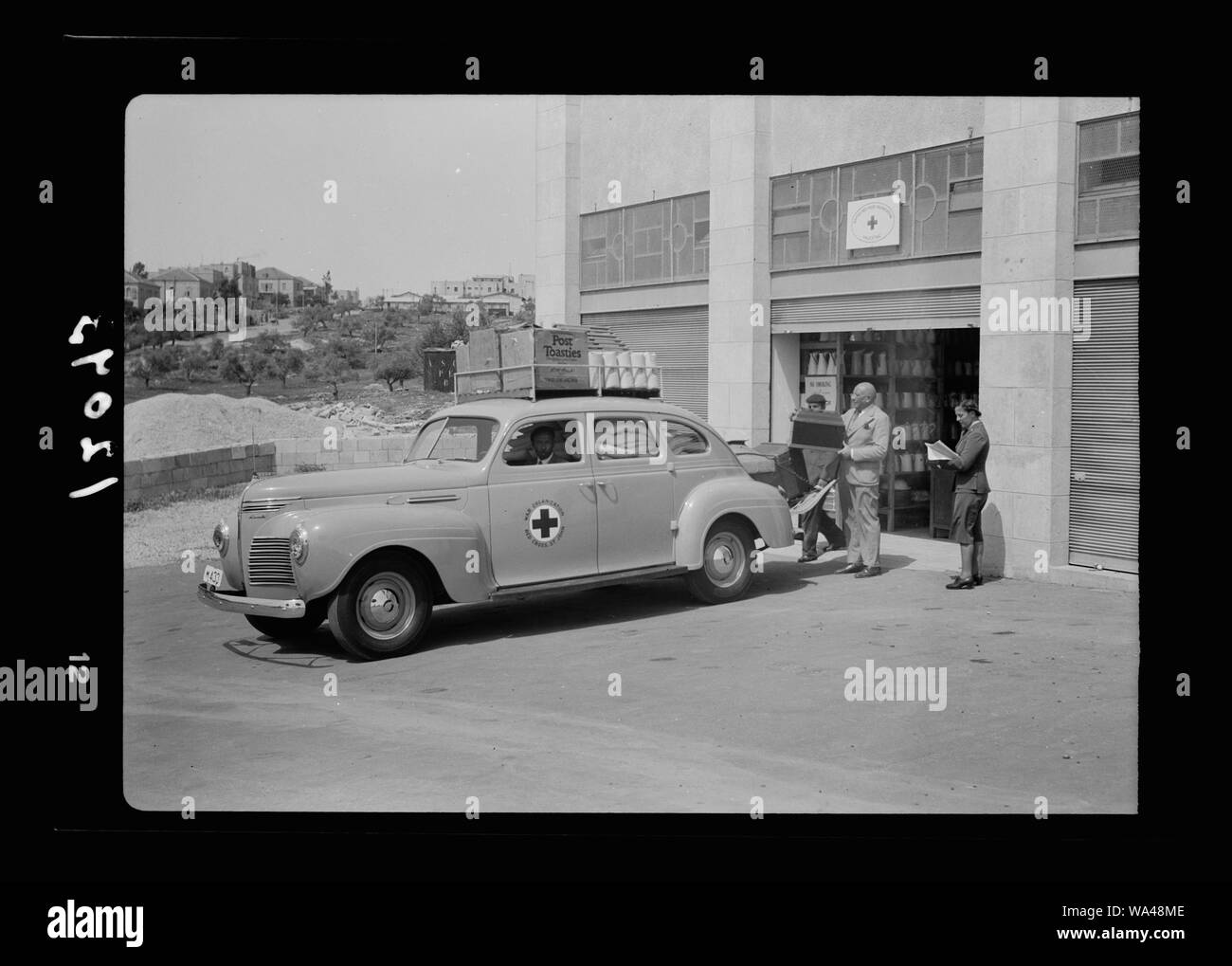 British Red Cross & St. John. Car outside main store [room] Stock Photo
