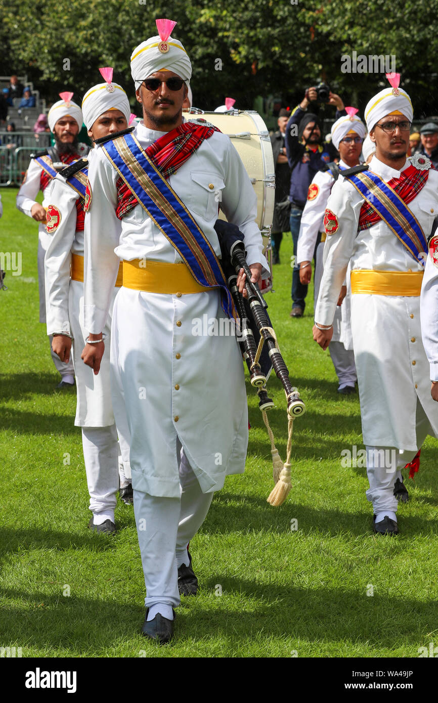 Glasgow, UK. 17th Aug 2019. The very popular and colourful Sri Dasmesh Pipe band from Malaysia had just completed their performances at the World Pipe band Championships at Glasgow Green, Glasgow, Scotland, UK Credit: Findlay/Alamy Live News Stock Photo