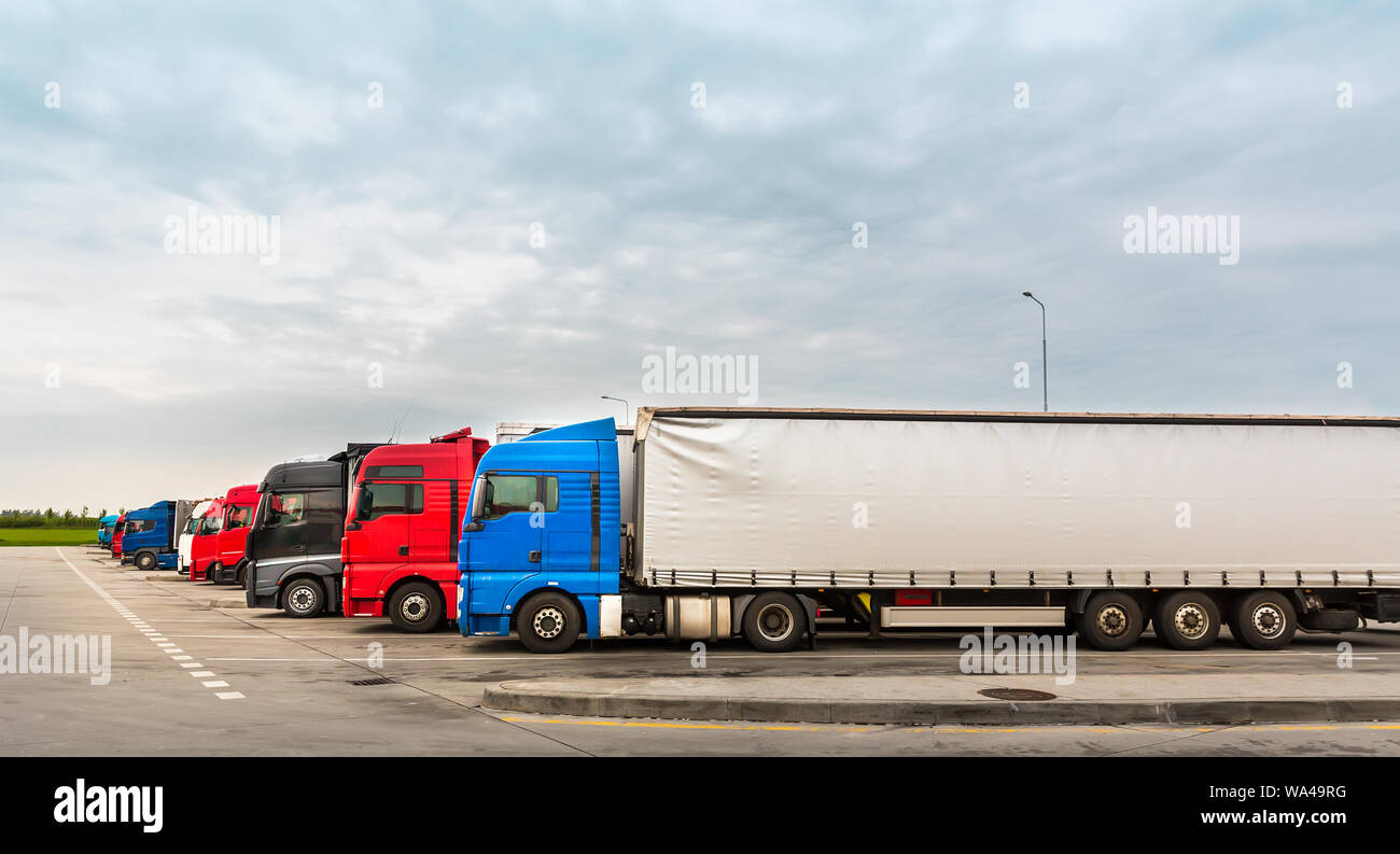 Trucks on parking, cargo transportation in Europe Stock Photo