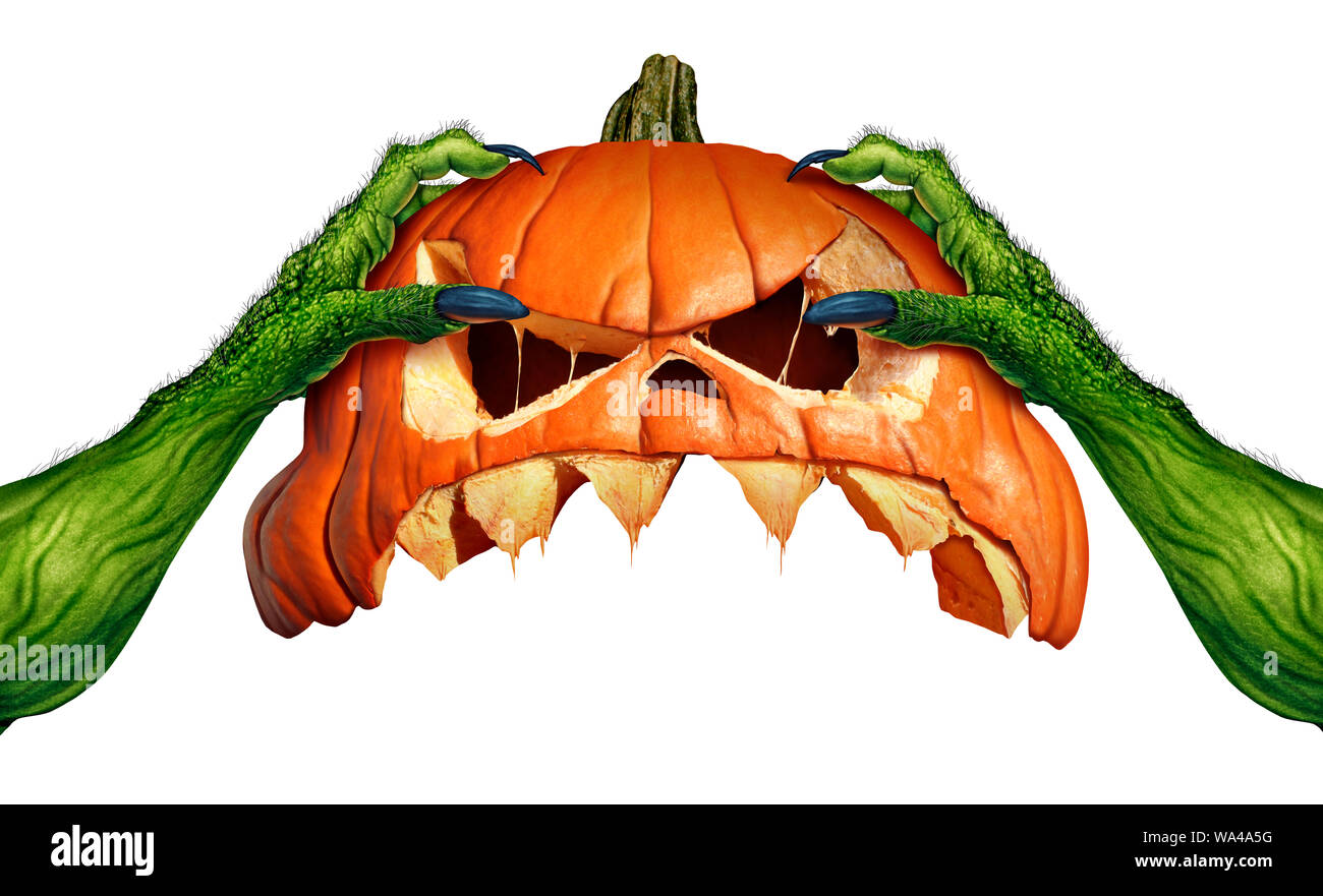 Monster halloween pumpkin green ogre hands holding a creepy pumpkin head jack o lantern that is as an autumn seasonal symbol for horror and spooky. Stock Photo