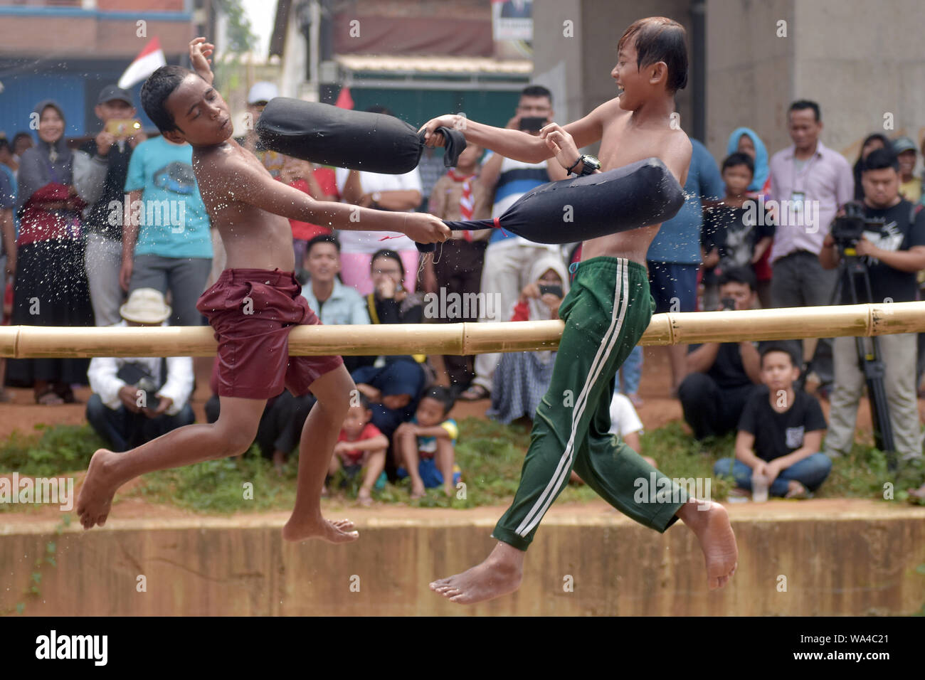 Boys slugging it out in a pillow fight during the celebrations.Indonesian people celebrated the country's 74th Independence Day, marking the anniversary of the declaration of independence from Dutch-colonial rule in the aftermath of World War II, with various traditional competitions as a reflection of the spirit of struggle. Stock Photo