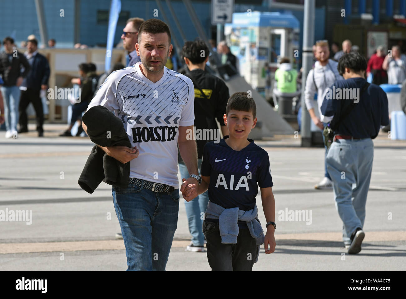 17th August 2019; Etihad Stadium, Manchester, Greater Manchester, England; Manchester City versus Tottenham Hotspur; Tottenham Hotspur fans arrive at the stadium for their game against Manchester City - Strictly Editorial Use Only. No use with unauthorized audio, video, data, fixture lists, club/league logos or 'live' services. Online in-match use limited to 120 images, no video emulation. Stock Photo