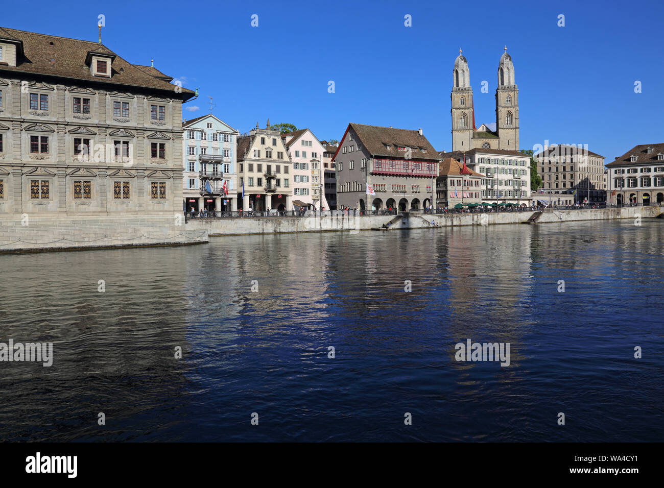Grossmunster Church reflecting in the Limmat river shot in Zurich, Switzerland. Stock Photo