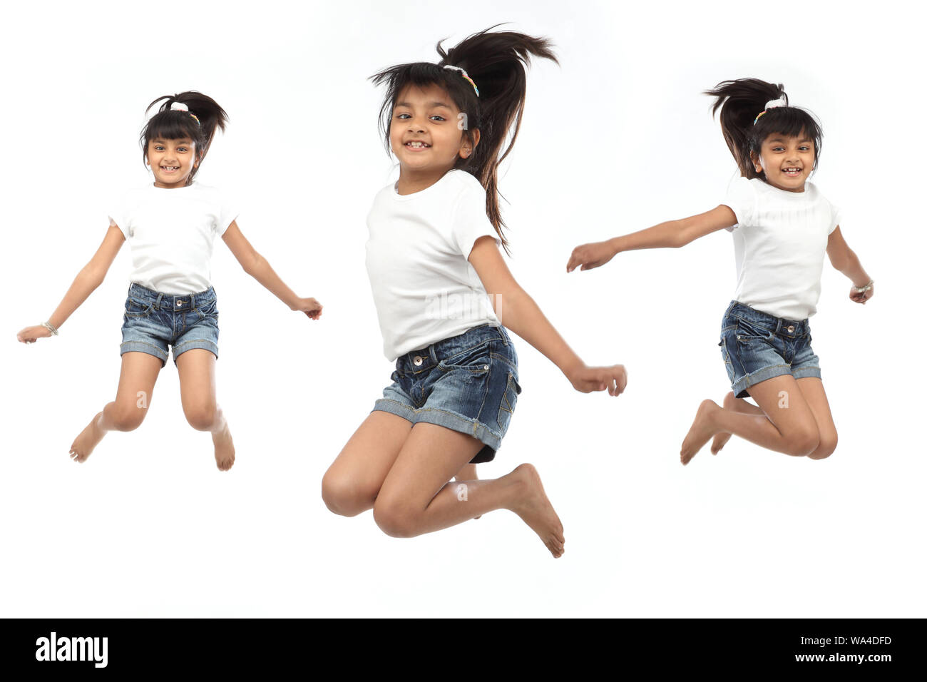 Multiple images of a girl jumping in air and smiling Stock Photo - Alamy