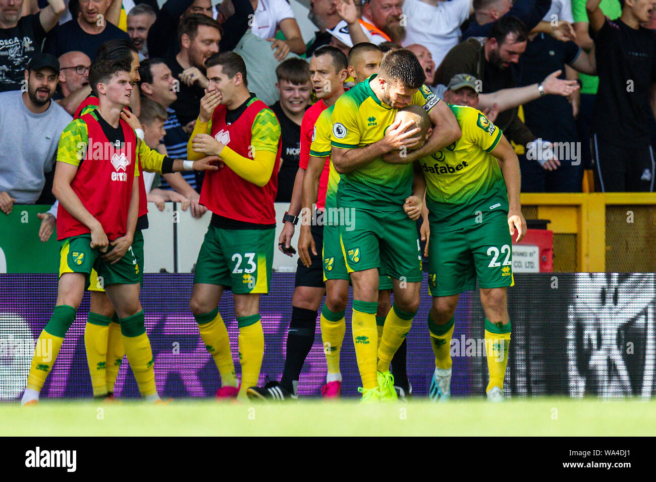 Norwich, UK. 17th Aug 2019. A kiss on the head from Grant Hanley of Norwich City for Teemu Pukki after scoring his third goal of the game in the Premier League match between Norwich City and Newcastle United at Carrow Road, Norwich on Saturday 17th August 2019. Editorial use only, license required for commercial use. Photograph may only be used for newspaper and/or magazine editorial purposes. (Credit: Alan Hayward | MI News) Credit: MI News & Sport /Alamy Live News Stock Photo