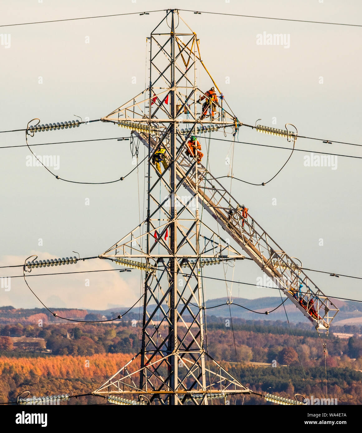 Beauly to Denny Pylon working Stock Photo