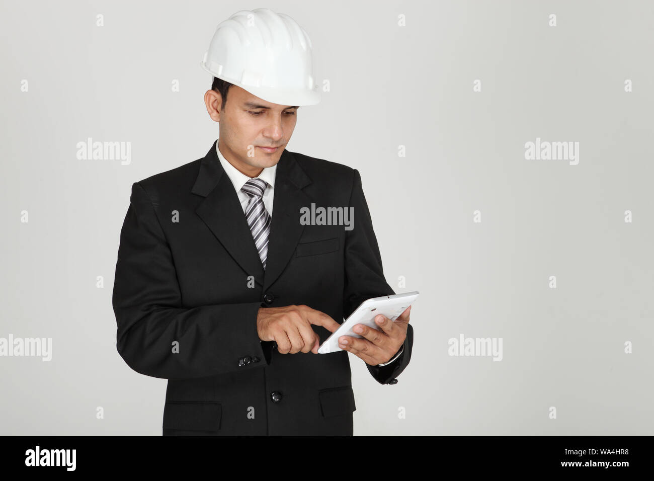 Businessman using a digital tablet Stock Photo