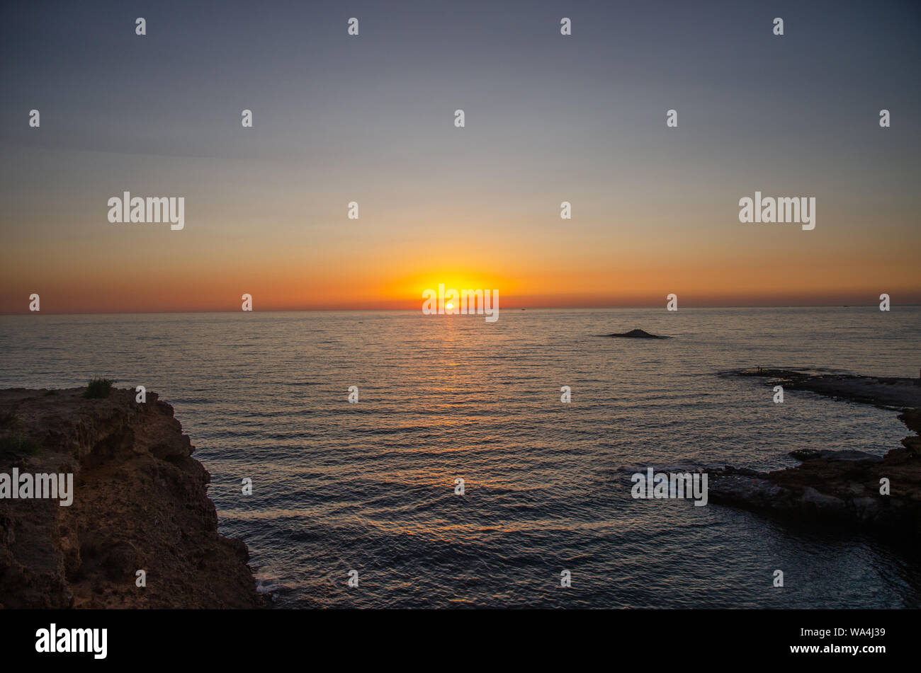 The sunset under the beautiful blue sky on beach Stock Photo - Alamy