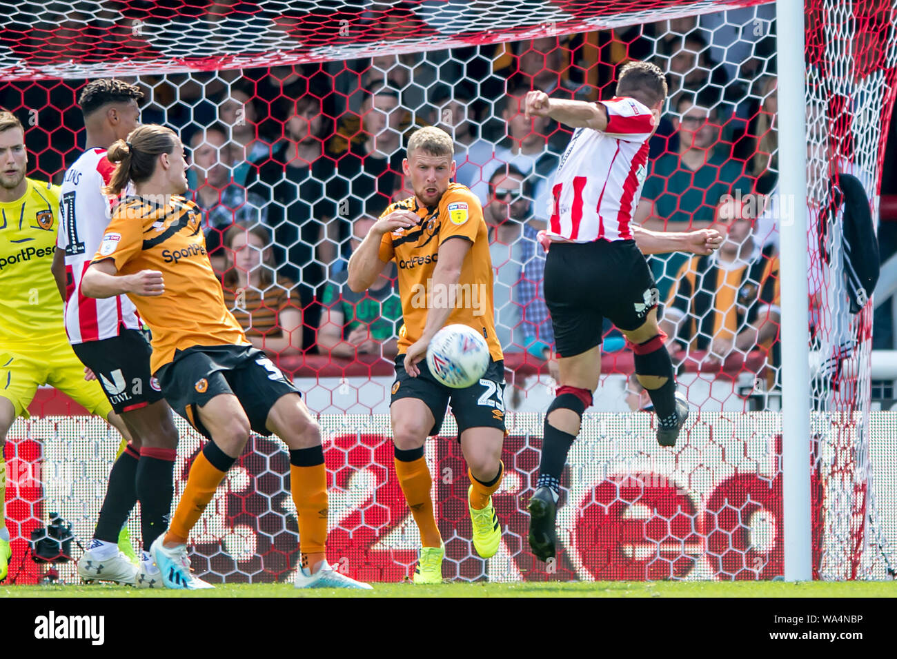 London, UK. 17th Aug, 2019. Stephen Kingsley of Hull City deflect the shot  of Sergi Canós of Brentford with his arm, handball during the EFL Sky Bet  Championship match between Brentford and