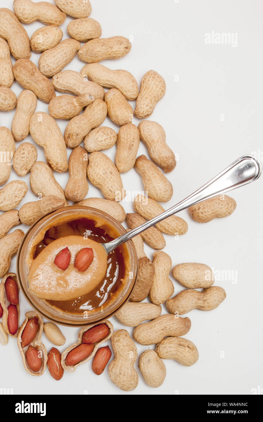 Creamy peanut butter in spoon isolated on white background, closeup. A  traditional product of American cuisine Stock Photo - Alamy