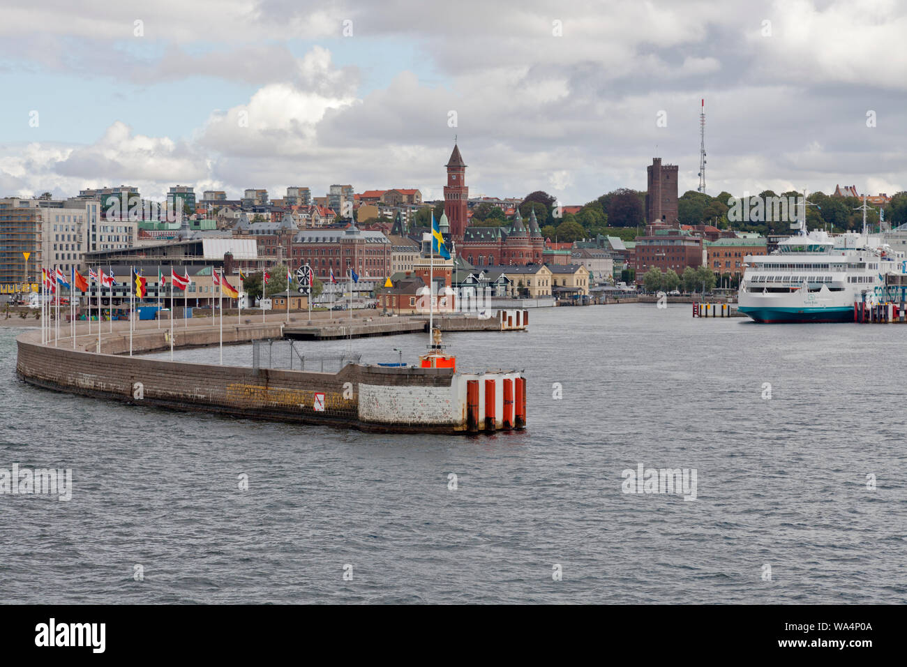 Helsingborg harbour entrance in Scania, Sweden. View of city. City hall, Kärnen Tower, electrically powered FORSEA ferry TYCHO BRAHE in berth. Stock Photo