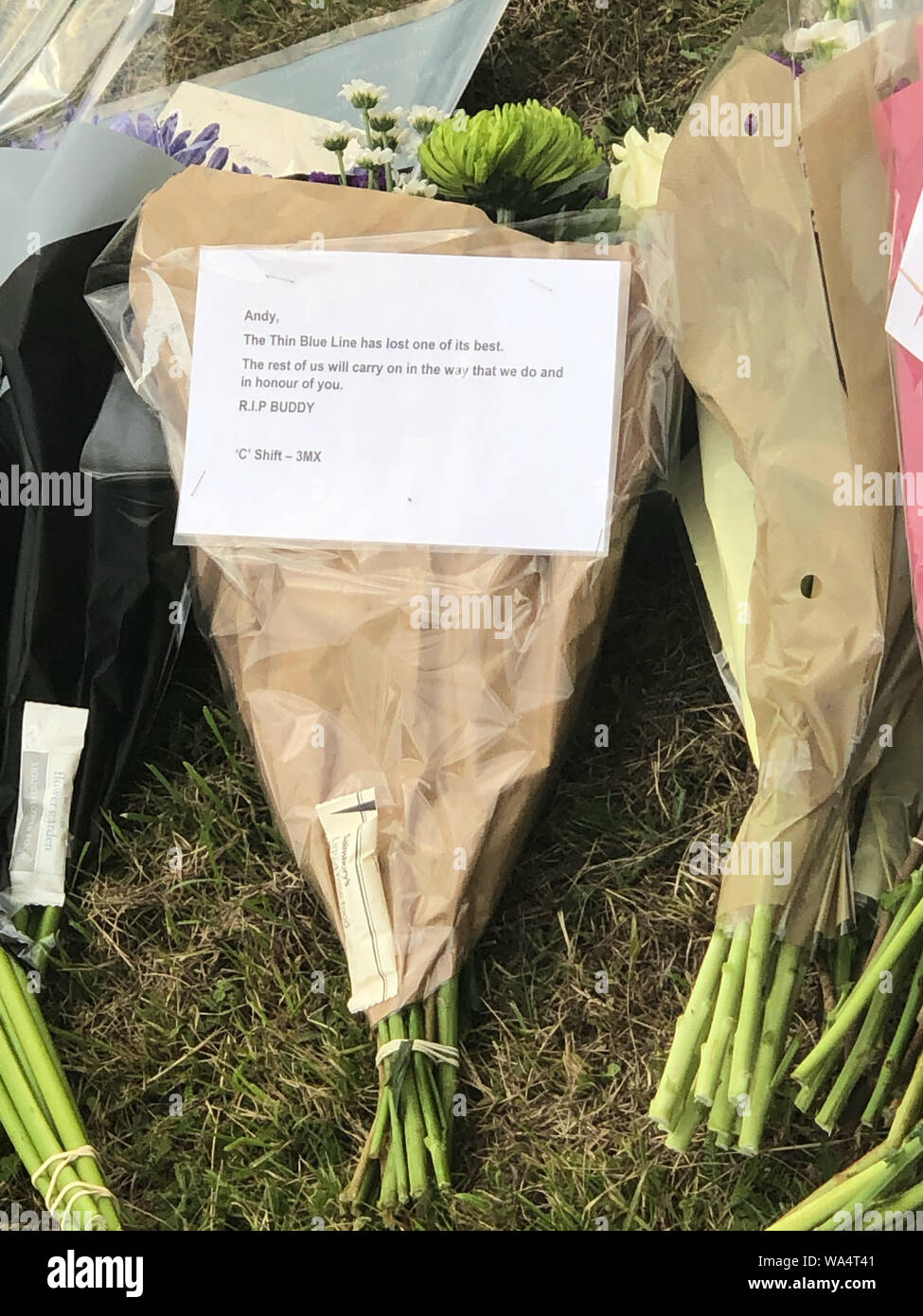 Floral tributes left at the scene in Ufton Lane, where Thames Valley Police officer Pc Andrew Harper, 28, died following a 'serious incident' at about 11.30pm on Thursday near the A4 Bath Road, between Reading and Newbury, at the village of Sulhamstead in Berkshire. Stock Photo