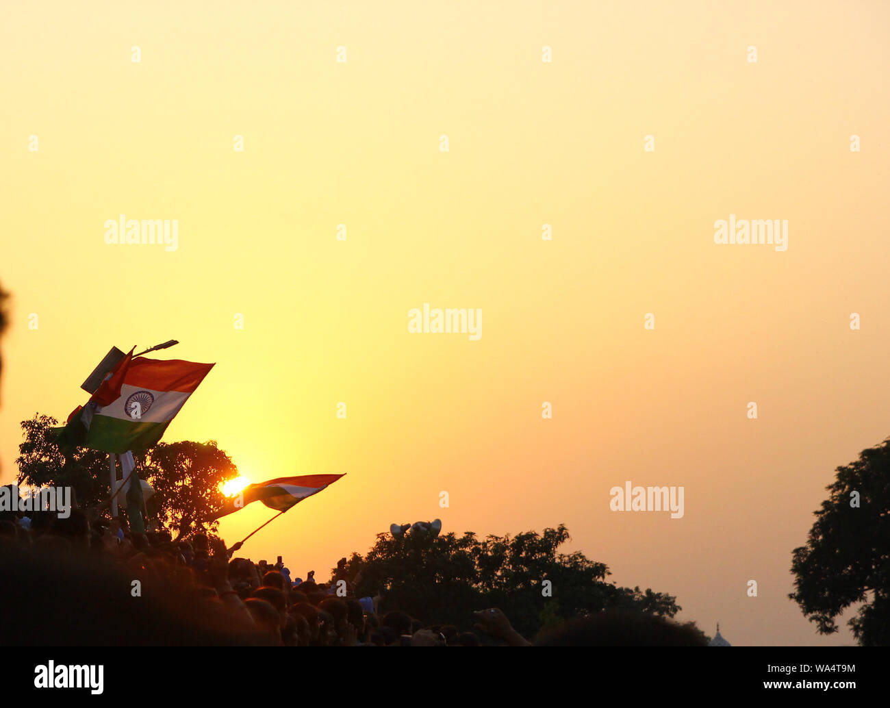 August 15,2018, Wagha Border, Amritsar, India. Indian flag waved by crowd during sunset at Wagha, India Pakistan Border at Amritsar India during India Stock Photo