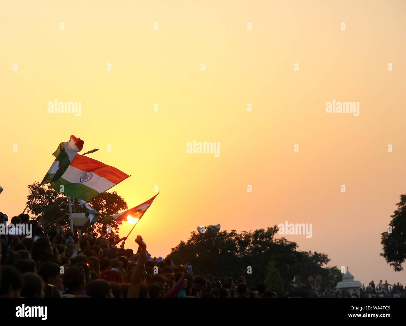August 15,2018, Wagha Border, Amritsar, India. Indian flag waved by crowd during sunset at Wagha, India Pakistan Border at Amritsar India during India Stock Photo