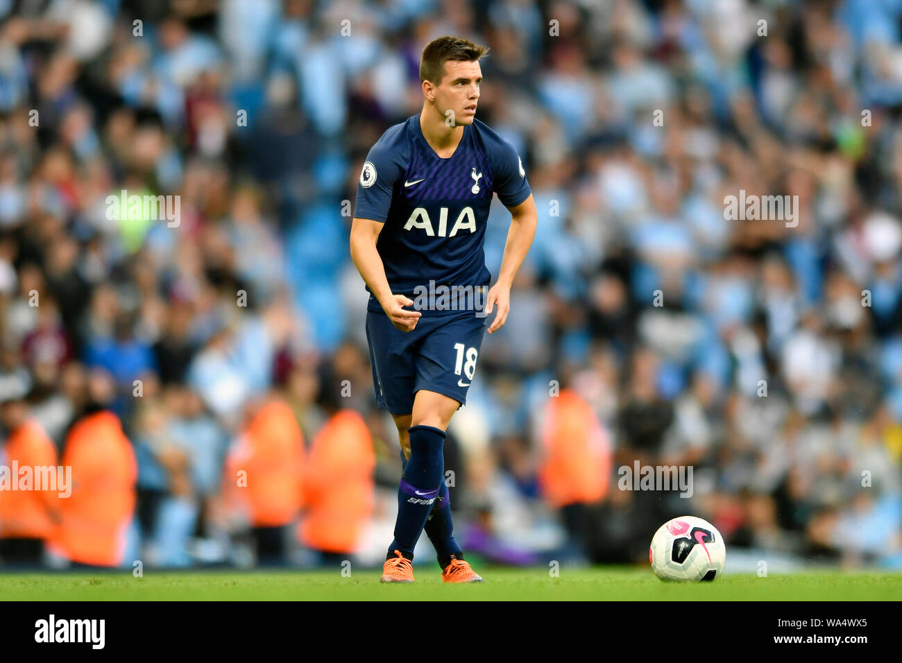 17th August 2019; Etihad Stadium, Manchester, Greater Manchester, England; Manchester City versus Tottenham Hotspur; Giovani Lo Celso of Tottenham Hotspur looks for passing options - Strictly Editorial Use Only. No use with unauthorized audio, video, data, fixture lists, club/league logos or 'live' services. Online in-match use limited to 120 images, no video emulation. Stock Photo