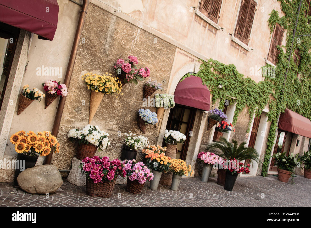 House With Lots Of Flowers In Italy Stock Photo Alamy