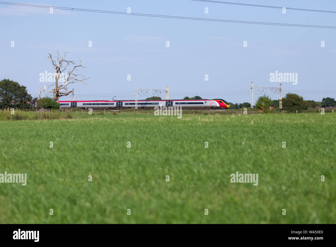 Virgin trains class 390 pendolino train on the west coast mainline in Cheshire. Stock Photo