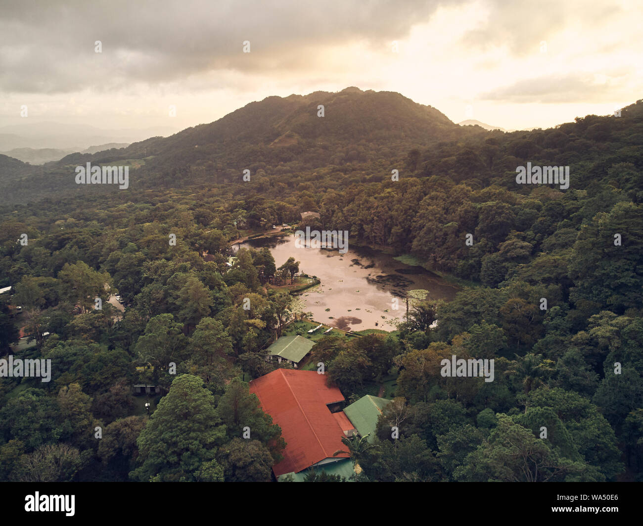 Mountain lake in sunset time aerial above drone view Stock Photo