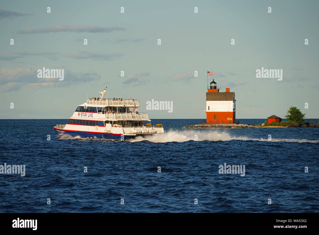 Mackinac Island ferry of Star Line passing Round Island Lighthouse in ...