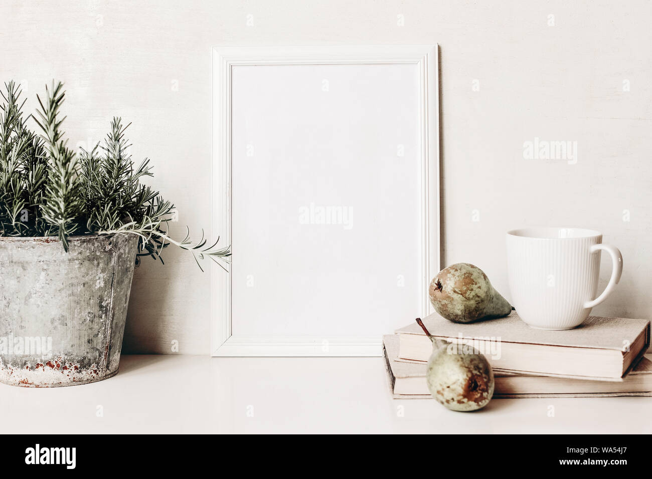 Download White Vertical Blank Wooden Frame Mockup Composition Of Rosemary Herb In Old Metal Flower Pot Books Cup Of Coffee And Pears On White Table Home Stock Photo Alamy PSD Mockup Templates