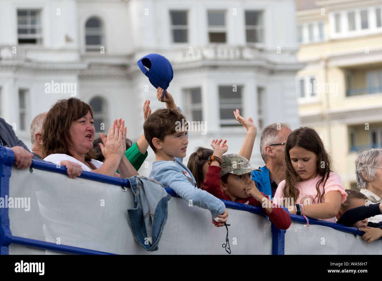 Eastbourne, UK. 17 Aug 2019. Spectators wave to the crews of the Battle of Britain Memorial Flight as it entertains the crowd at this popular air show on the UK South coast. Flying displays and  ground based entertainments form this four day event  Credit:Alan Fraser Stock Photo