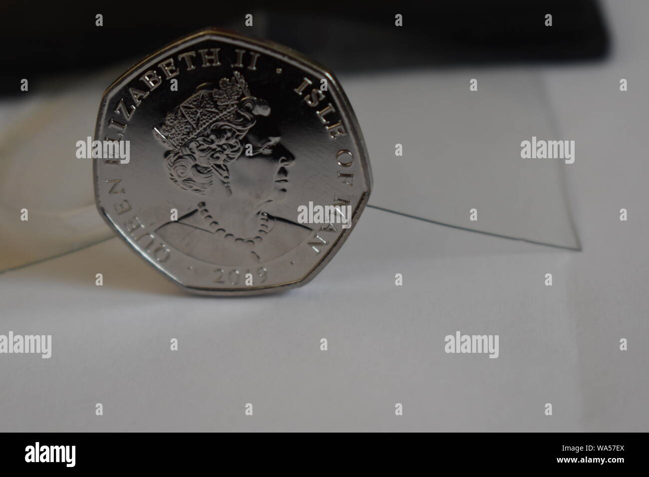 Brand new reverse side of the 2019 release by the Mint, of the new Peter Pan Fifty Pence. Queens head Set against a black and transparent background. Stock Photo