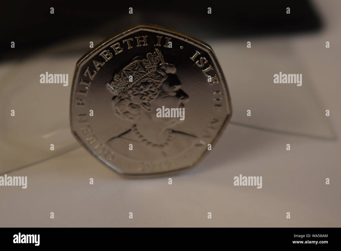 Brand new reverse side of the 2019 release by the Mint, of the new Peter Pan Fifty Pence. Queens head Set against a black and transparent background. Stock Photo