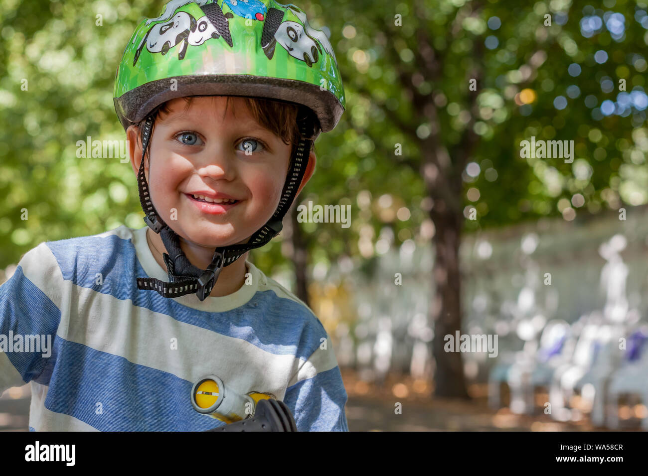 Toddler wearing helmet Stock Photo Alamy