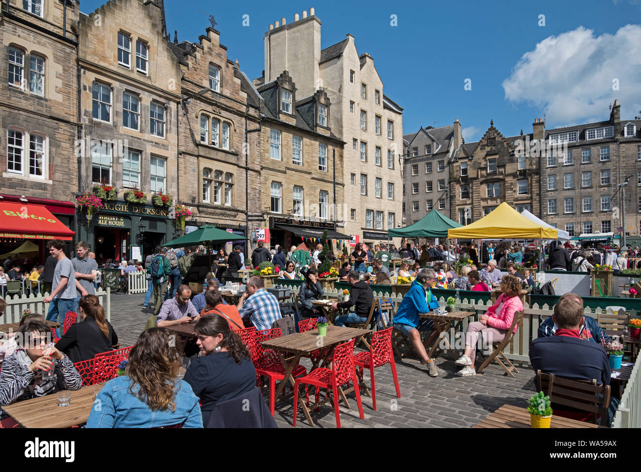 Tourists and locals alike eating outside and enjoying some early summer